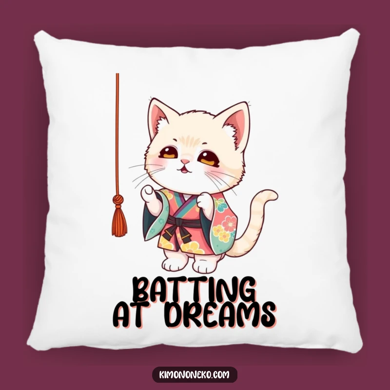 Cuddle up with this funny pillow, depicting a mischievous kitten in a colorful kimono engrossed in string play. Brings comfort and joy to your space.