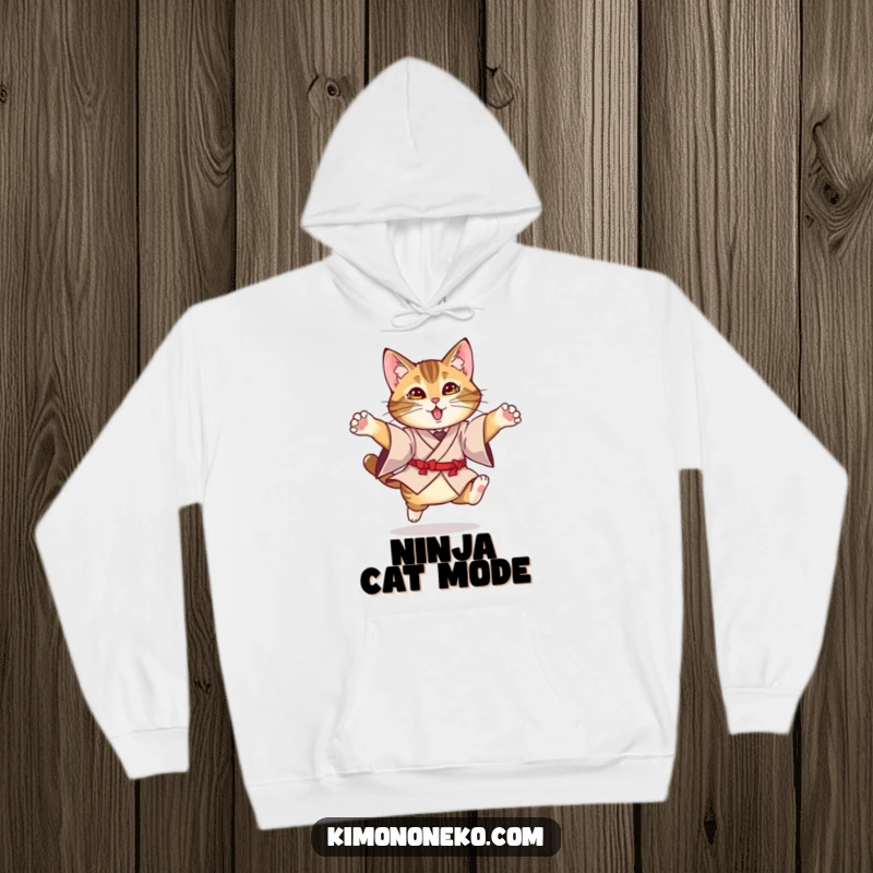 Funny Kimono Cat Hoodie: A tabby cat in a formal kimono captured in a humorous, graceful leaping pose.