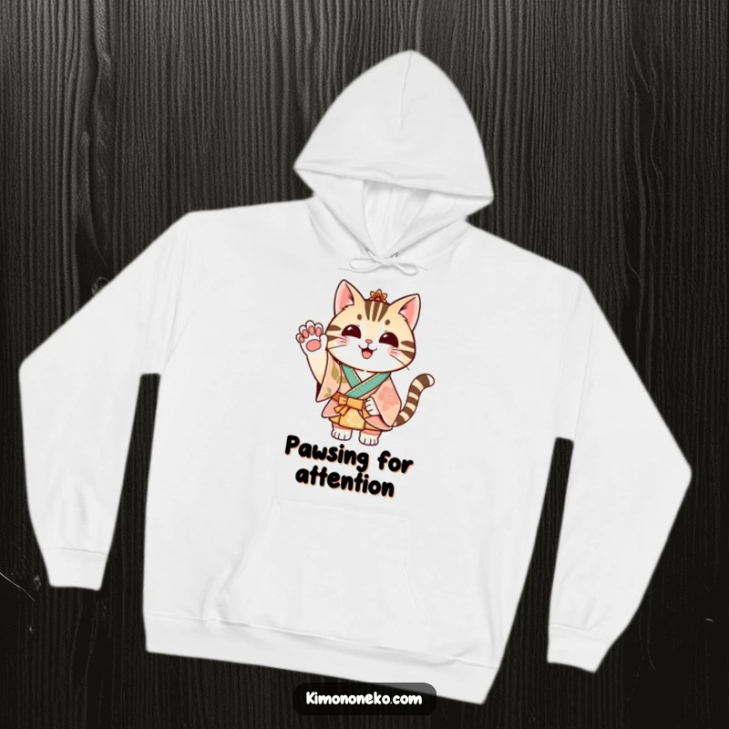 Funny striped cat in a festive kimono waving its paw, printed on a soft and warm hoodie.