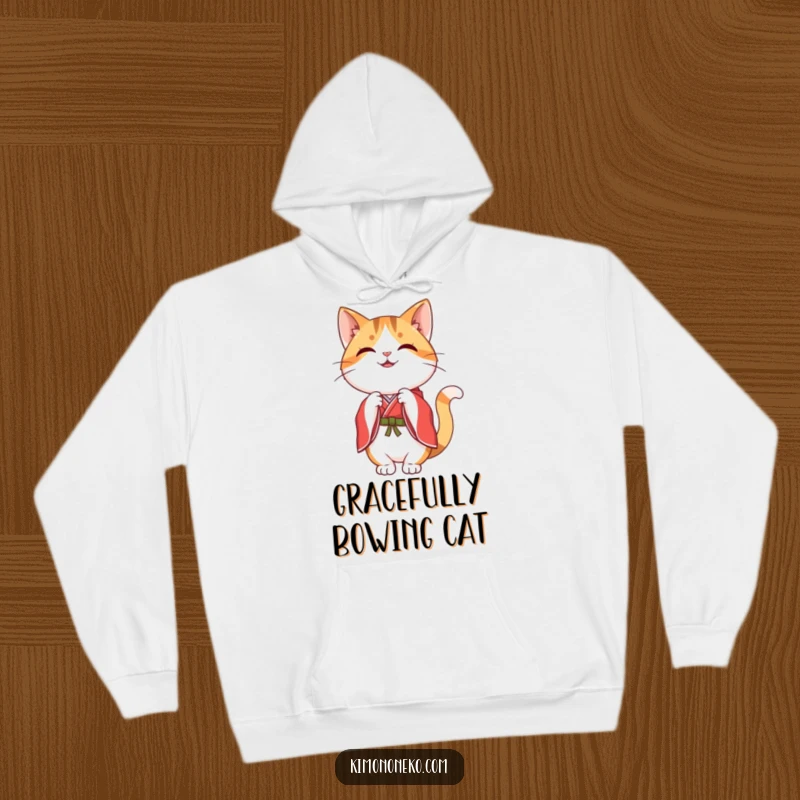 Funny happy kawaii calico cat in a red and white kimono, performing a graceful bow, on a warm hoodie.
