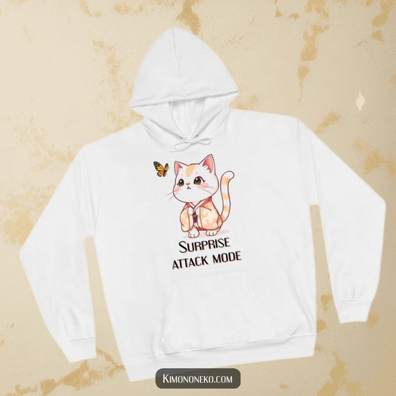 Funny hoodie with a festive cat in a kimono, its tail comically puffed up in surprise as it encounters a fluttering butterfly, exuding adorable shock.