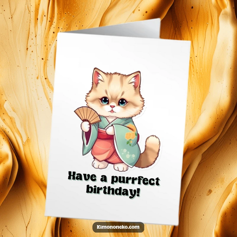 Funny Free Printable Birthday Card: An elegant, fluffy cat in a vibrant kimono poses gracefully with a decorative fan.