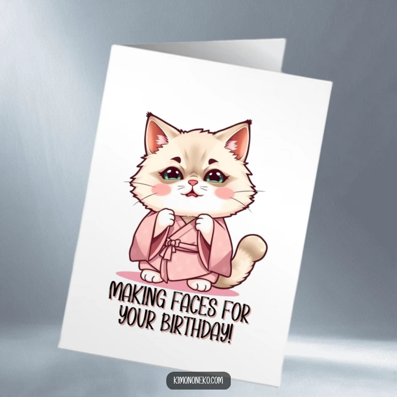 Funny Free Printable Birthday Card: Kawaii Ragdoll cat in a soft kimono, practicing a hilarious, silly expression.