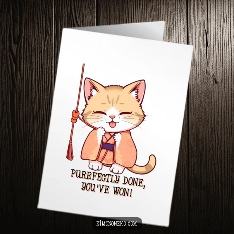 Funny Free Printable Congratulations Card featuring a mischievous cat in a kimono, playfully batting at a silk cord.