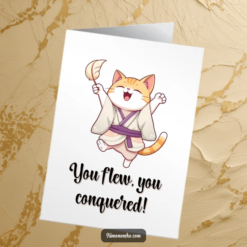 Funny Free Printable Congratulations Card of a joyful cat in a kimono, leaping playfully to catch a floating feather.