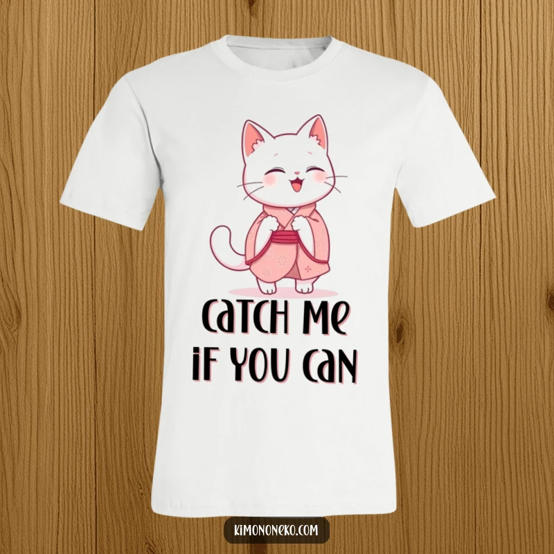Funny Kawaii Cat T-Shirt: A cute white cat in a pink kimono is joyfully chasing its tail, embodying pure, funny, playful energy.
